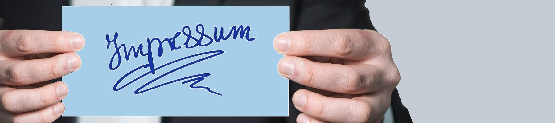 Schild mit Aufschrift Impressum